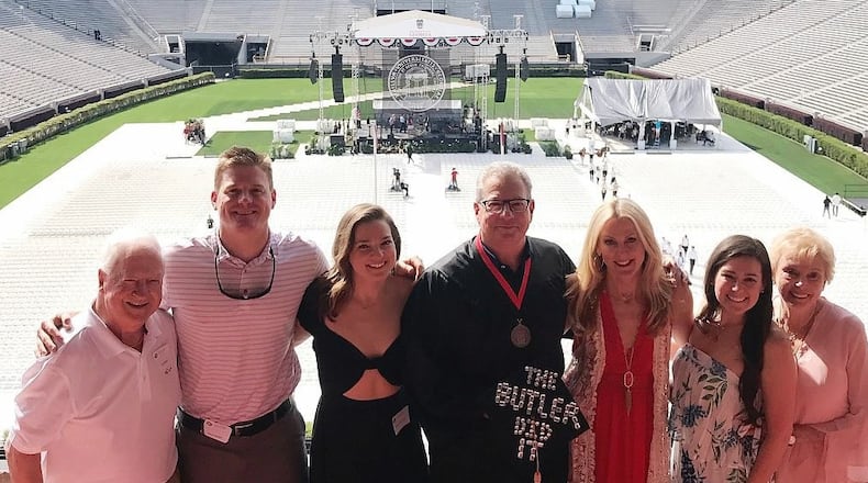 It's graduation day at UGA, Butler style. Kevin Butler, with cap and gown, is joined, from left, by father Joe, son Drew, daughter Savannah, wife Cathy, daughter Scarlett Sugar and mother Sharon. (Photo courtesy of Kevin Butler)