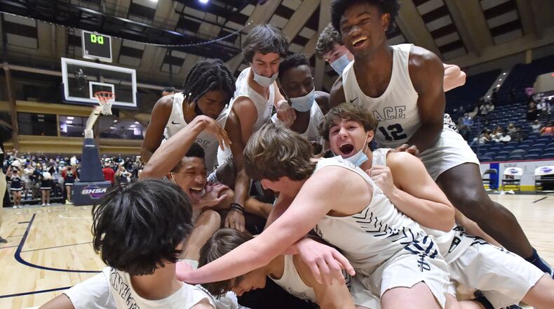 March 11, 2021 Macon - Pace Academy players celebrate their victory over Columbia during the 2021 GHSA State Basketball Class AA Boys Championship game at the Macon Centreplex in Macon on Thursday, March 11, 2021 Pace Academy won 73-42 over Columbia. (Hyosub Shin / Hyosub.Shin@ajc.com)