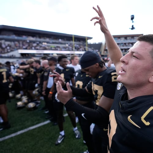 Vanderbilt quarterback Diego Pavia, right, celebrates the team's win with teammates after an NCAA college football game against LSU, Saturday, Oct. 18, 2025, in Nashville, Tenn. (AP Photo/George Walker IV)