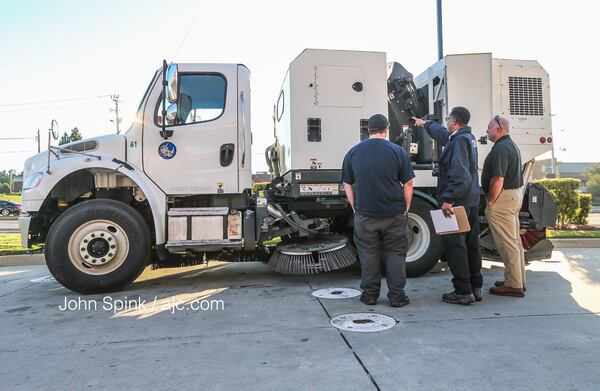 Occupational Safety and Health Administration officials were on the scene of a deadly incident involving a street sweeper. JOHN SPINK / JSPINK@AJC.COM