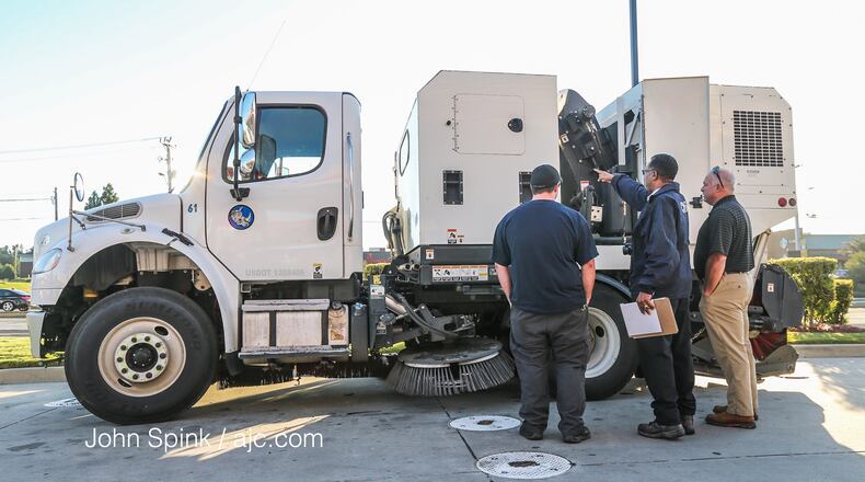 Occupational Safety and Health Administration investigators spent five hours at the scene of Orlando Hall's deadly street sweeper accident in Gwinnett County in September 2017. JOHN SPINK / JSPINK@AJC.COM