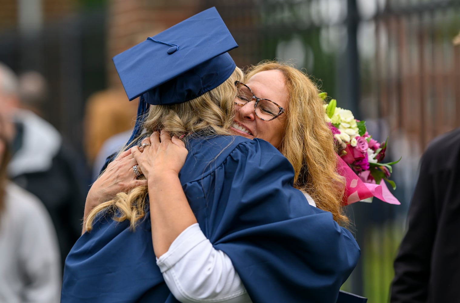 Berry College graduate Kara Schmit gets a hug from her mom, Sue Schmit, on Saturday May 9, 2026, at the commencement ceremony in Rome, Ga. (Brant Sanderlin/Berry College)