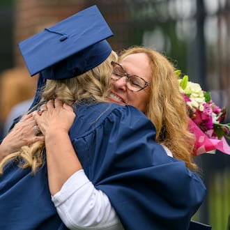 Berry College graduate Kara Schmit gets a hug from her mom, Sue Schmit, Saturday, May 9, 2026. (Courtesy of Brant Sanderlin/Berry College)