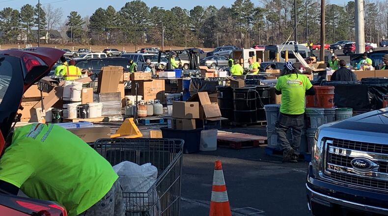 Cars line the parking lot of the Gwinnett County Fairgrounds in February 2022 to properly dispose of hazardous household waste like paint, lawn chemicals and more. (Courtesy Gwinnett Clean & Beautiful)