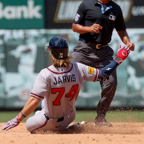 Atlanta Braves' Jim Jarvis (74) slides into second base after hitting a double during the sixth inning of a baseball game against the St. Louis Cardinals, Sunday, July 12, 2026, in St. Louis. (AP Photo/Scott Kane)