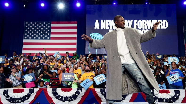 Usher walks on stage Saturday, Oct. 19, 2024, during a campaign rally for Vice President Kamala Harris, the Democratic presidential nominee, at the Lakewood Amphitheater in Atlanta. (Erin Schaff/New York Times)