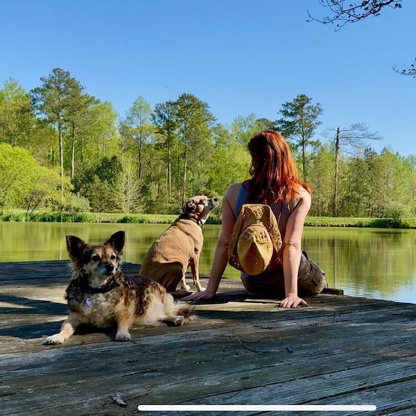 Dagmar Midcap spends time with her dogs at Serenbe, where she lived for a time when she returned to Atlanta. (Courtesy of Dagmar Midcap)