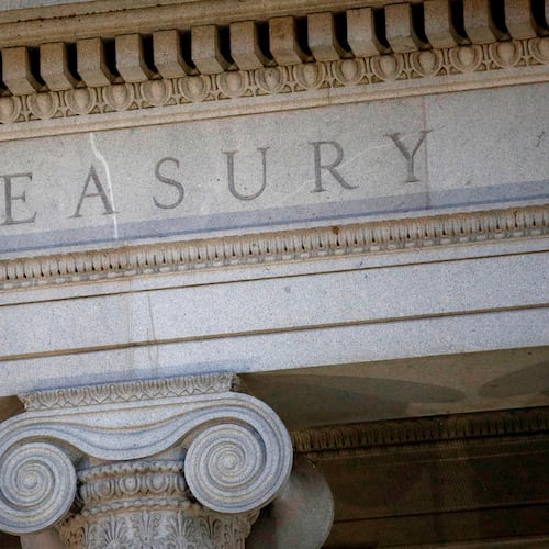 FILE - The Treasury Department building is pictured at dusk in Washington, June 6, 2019. (AP Photo/Patrick Semansky, File)