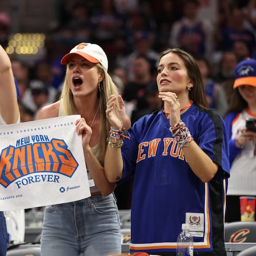 New York Knicks fans cheer during the second half of Game 4 in the Eastern Conference finals NBA basketball playoffs series against the Cleveland Cavaliers in Cleveland, Monday, May 25, 2026. (AP Photo/Tim Phillis)