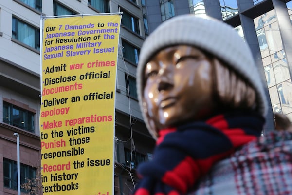 FILE - A statue symbolizing a wartime sex slave is displayed near the Japanese Embassy in Seoul, South Korea, on Jan. 8, 2021. (AP Photo/Ahn Young-joon, File)