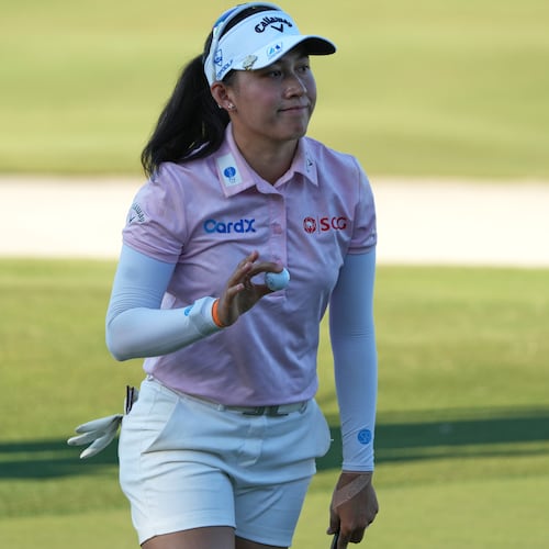 Jeeno Thitikul of Thailand shows her ball after making a birdie putt on the 17th hole during the second round of the LPGA Tour Championship golf tournament, Friday, Nov. 21, 2025, in Naples, Fla. (AP Photo/Marta Lavandier)
