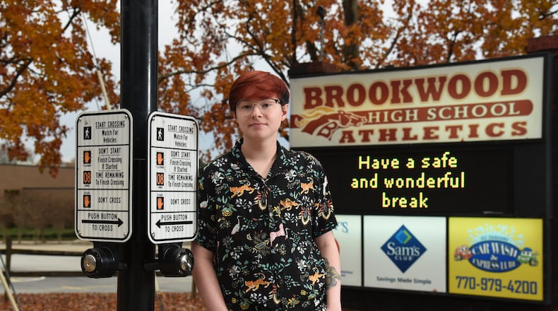 Christopher Taylor, a transgender male who graduated from Brookwood High in May 2019, stands outside Brookwood High School in Snellville on Nov. 22, 2019. Taylor, who said he experienced bullying, name-calling and fear in school, said he believes it’s important for school officials to have guidelines to follow. HYOSUB SHIN / HYOSUB.SHIN@AJC.COM