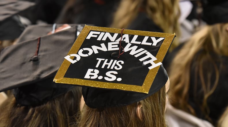 May 4, 2018 Athens - University of Georgia students wear decorated caps during the 2018 spring undergraduate commencement ceremony at Sanford Stadium in Athens. The B.S. on this student’s cap probably means bachelor’s of science. Probably.