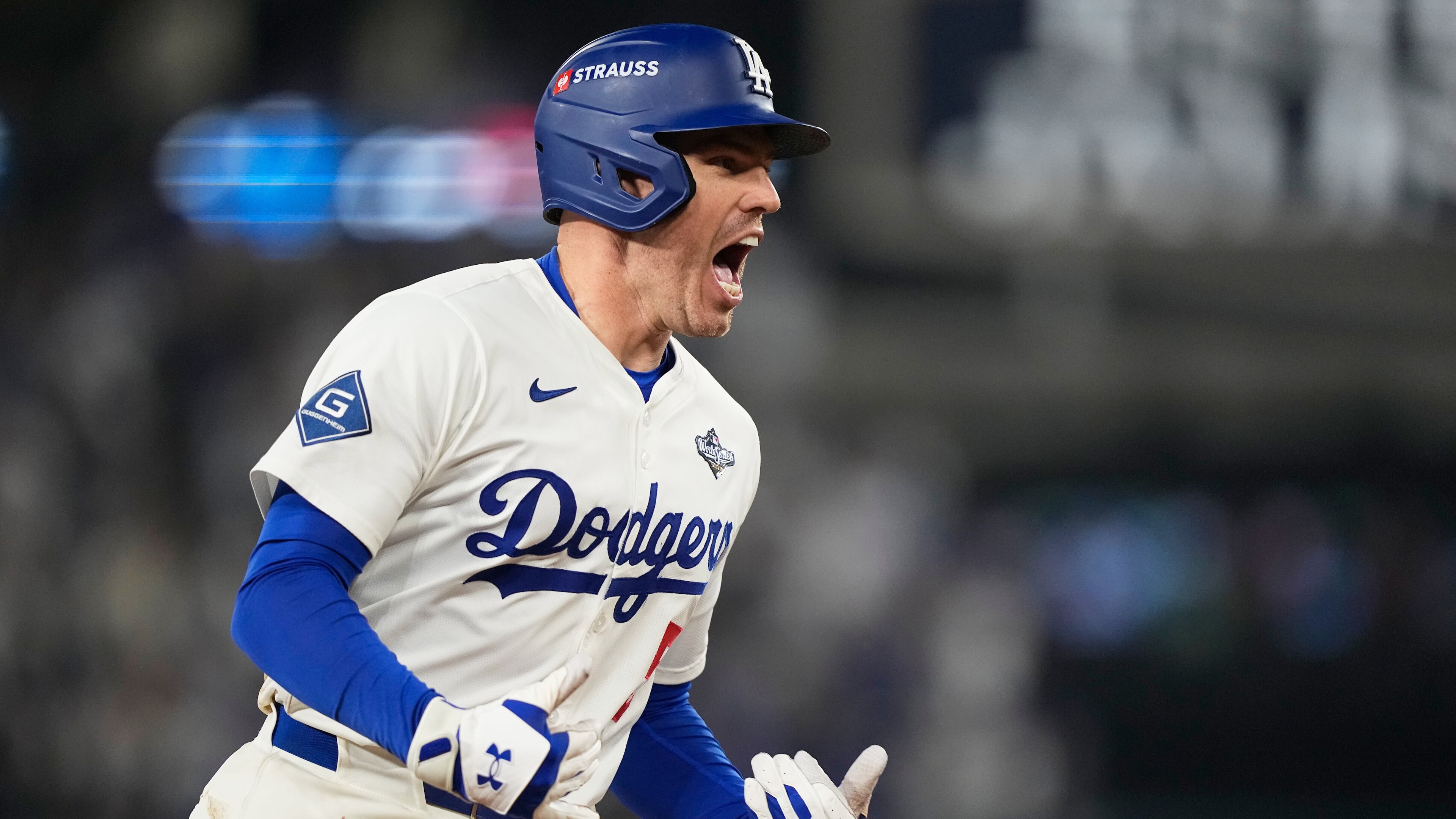 Los Angeles Dodgers' Freddie Freeman celebrates his walk off home run against the Toronto Blue Jays during the 18th inning in Game 3 of baseball's World Series, Monday, Oct. 27, 2025, in Los Angeles.(AP Photo/Brynn Anderson)