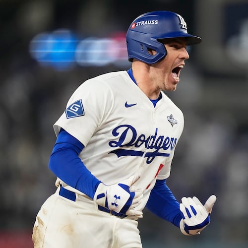 Los Angeles Dodgers' Freddie Freeman celebrates his walk off home run against the Toronto Blue Jays during the 18th inning in Game 3 of baseball's World Series, Monday, Oct. 27, 2025, in Los Angeles.(AP Photo/Brynn Anderson)