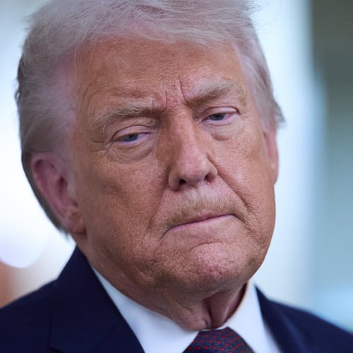 President Donald Trump speaks with reporters aboard Air Force One after leaving the World Economic Forum in Davos for Washington, Thursday, Jan. 22, 2026. (AP Photo/Evan Vucci)