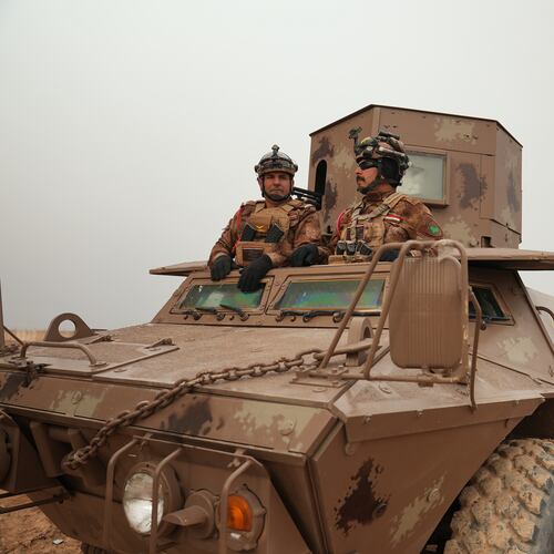 Iraqi Border Guards patrol in armored vehicles along the border with Syria, in Sinjar, northern Iraq, Thursday, Jan. 22, 2026. (AP Photo/Farid Abdulwahed)