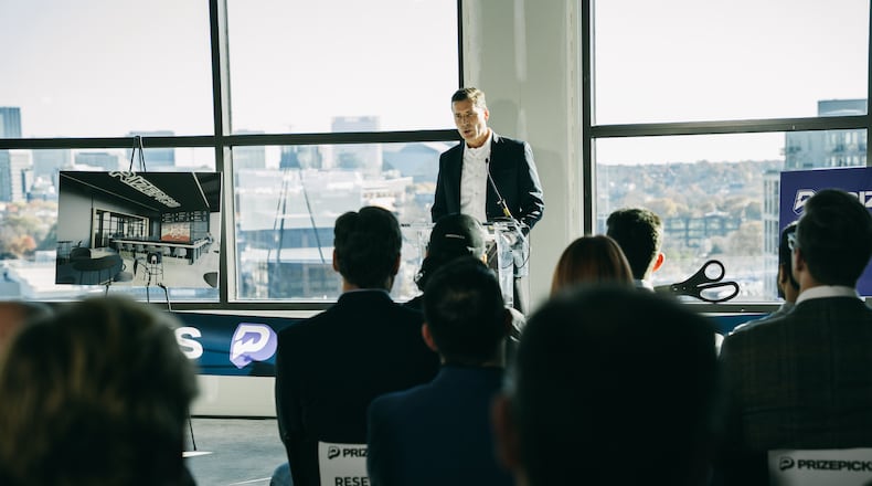 PrizePicks CEO Mike Ybarra speaks at his company's office ribbon-cutting ceremony in Atlanta on Thursday, Dec. 12, 2024 (Olivia Bowdoin for the AJC).