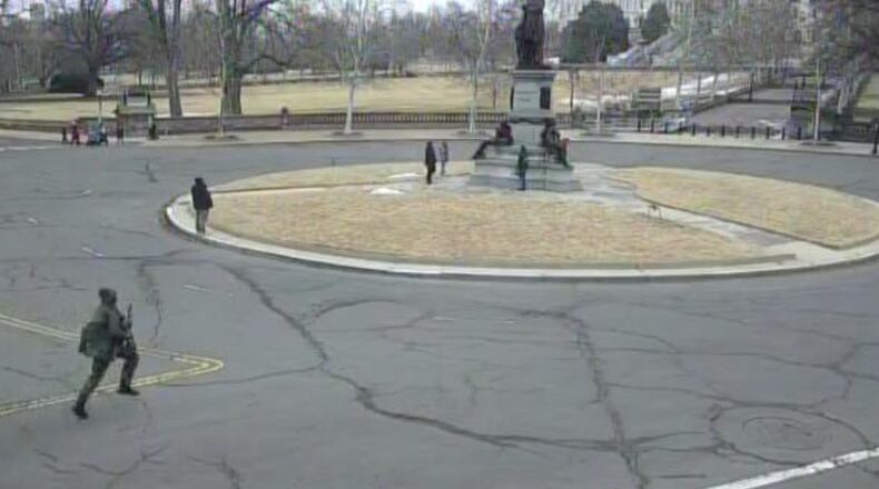 This image from video contained in the Justice Department's memorandum in support of pretrial detention of Carter Camacho, 18, shows Camacho running near the U.S. Capitol in Washington, Feb. 17, 2026. (Justice Department via AP)