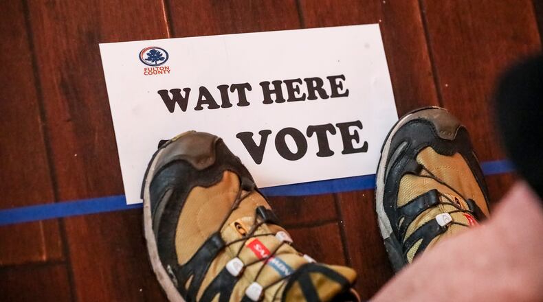 May 25, 2022 Atlanta: Voters at Park Tavern located at 500 10th Street NE, Atlanta. Voters encountered short lines and limited problems as election day got underway in Georgia on Monday, May 25, 2022 making their voices heard in one of the politically competitive states in the nation. But there were initial hiccups in a few voting locations. Some voters arrived at the polls to find their precincts had been moved to different locations. Others had short waits during the initial morning rush. Several voting locations had problems starting voting machines. In Fulton County, voting was running smoothly at almost all of the county's 250 polling sites, in part thanks to the 91,000 voters who cast their ballots during three weeks of early voting, said Interim Elections Director Nadine Williams. Two polling places, Hopewell Middle in Milton and Creel Park in South Fulton, opened 20 to 30 minutes late. Williams didn't provide a reason for the delays, but she said the county is asking a judge to allow the sites to close later so everyone can vote. She said some poll workers were 'no-shows' but they had staff in reserve. Williams encouraged folks to vote during lunch hours. The New Georgia Project, a voting rights group which monitors election issues, reported the polling place at Bethesda Elementary School in Gwinnett County opened about 30 minutes late. At North Decatur Presbyterian Church, two voting touchscreens weren't working because of a problem with their batteries, but poll workers said they had enough functioning touchscreens to avoid delays. About 70 voters cast ballots in the first hour of voting. Another voter, Marcia King, said she needed help from a poll worker to figure out how to print her ballot from the touchscreen. "This was very easy with no problems at all, and people were there to help," King said. (John Spink / John.Spink@ajc.com)