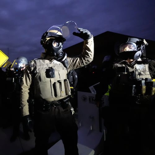 Law enforcement standoff with protesters outside an ICE processing facility in the Chicago suburb of Broadview, Ill., Saturday, Nov. 1, 2025. (AP Photo/Alex Brandon)