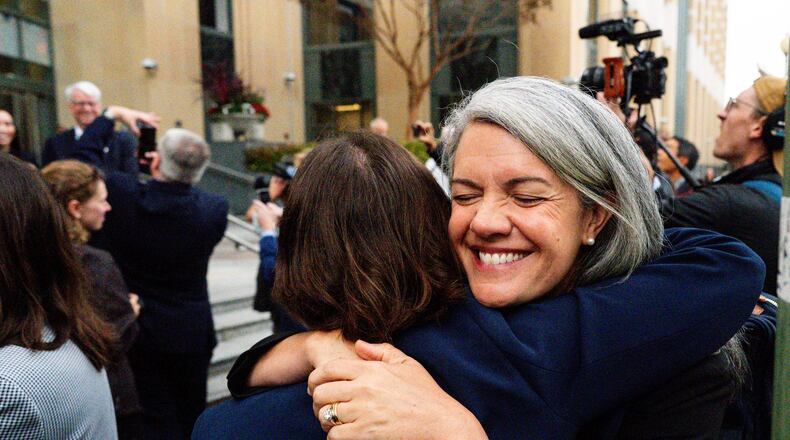 Colorado Solicitor General Shannon Stevenson, right, hugs a colleague outside of court after tech giant Meta agreed to pay $17 billion as part of a settlement to end a landmark trial over teen social media addiction in Oakland, Wednesday, Aug. 26, 2026. (AP Photo/Noah Berger)