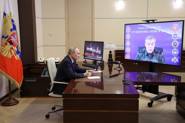 Russian President Vladimir Putin listens to Russian Chief of General Staff Gen. Valery Gerasimov with the report that all Ukrainian troops have been forced from Russia's Kursk region, during their meeting via videoconference in Moscow, Russia, Saturday, April 26, 2025. (Alexander Kazakov, Sputnik, Kremlin Pool Photo via AP)