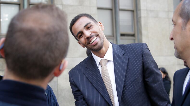 Thabo Sefolosha receives congratulations outside the criminal courts in New York, Friday, Oct. 9, 2015. The Atlanta Hawks’ player was acquitted in a case stemming from a police fracas outside a New York City nightclub. (AP Photo/Seth Wenig)