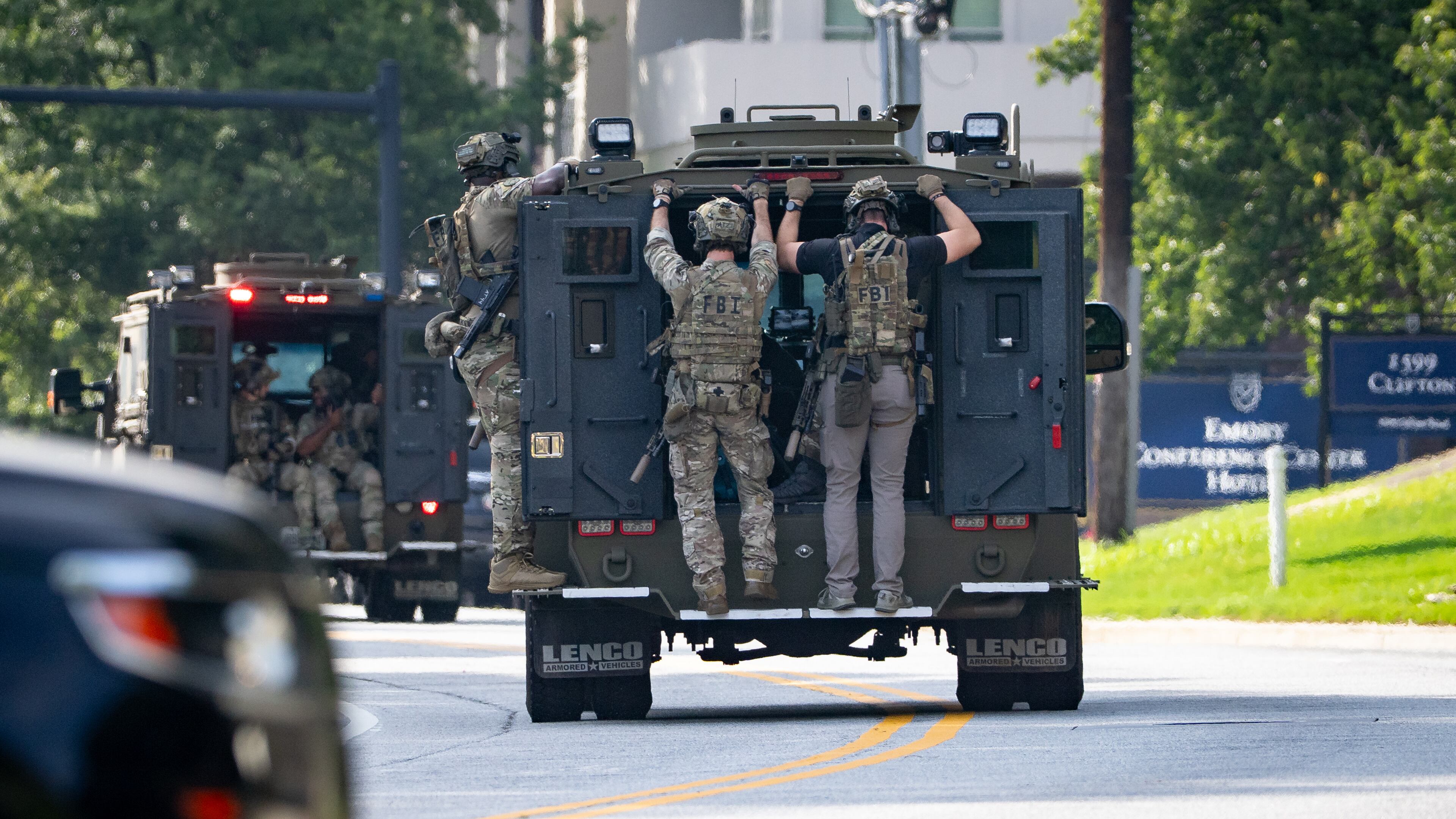 The FBI Atlanta SWAT team arrives at the scene of the shooting near the CDC building on Friday. (Ben Hendren for the AJC)