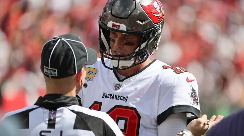 Bucs quarterback Tom Brady talks with a referee after his throw to wide receiver Mike Evans was challenged on Sunday.  (Luis Santana/Tampa Bay Times/TNS)