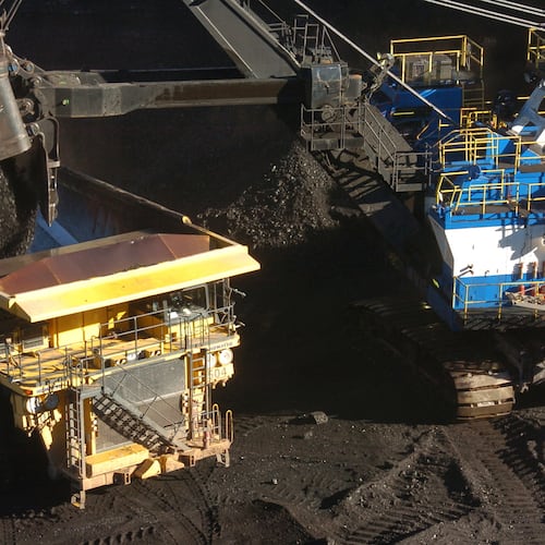 FILE - A mechanized shovel loads coal into a haul truck at a mine near Decker, Mont., on Nov. 15, 2016. (AP Photo/Matthew Brown, File)