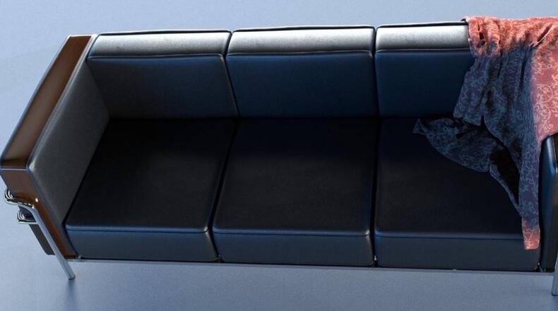 A couch randomly appeared in a tree outside an apartment building in New York City.