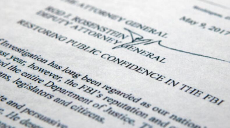 The letter from Deputy Attorney General Rod Rosenstein titled "Restoring Public Confidence in the FBI" is photographed in Washington, Tuesday, May 9, 2017. President Donald Trump abruptly fired FBI Director James Comey, ousting the nation's top law enforcement official in the midst of an investigation into whether Trump's campaign had ties to Russia's election meddling. In the letter to Comey, Trump said the firing was necessary to restore "public trust and confidence" in the FBI. (AP Photo/Jon Elswick)