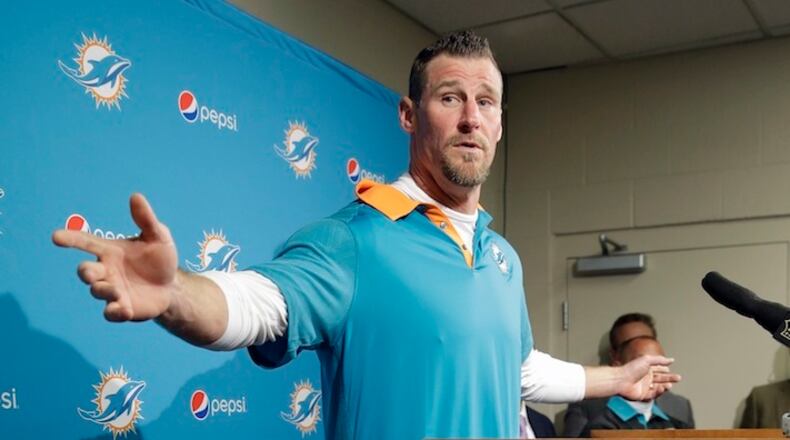 Miami Dolphins interim head coach Dan Campbell answers questions after an NFL football game against the Tennessee Titans Sunday, Oct. 18, 2015, in Nashville, Tenn. The Dolphins won 38-10. (AP Photo/James Kenney)