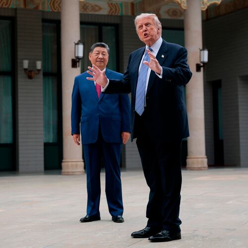 U.S. President Donald Trump, right, gestures as he speaks next to Chinese President Xi Jinping during a visit to the Zhongnanhai Garden in Beijing, China, Friday, May 15, 2026. (Evan Vucci/Pool Photo via AP)