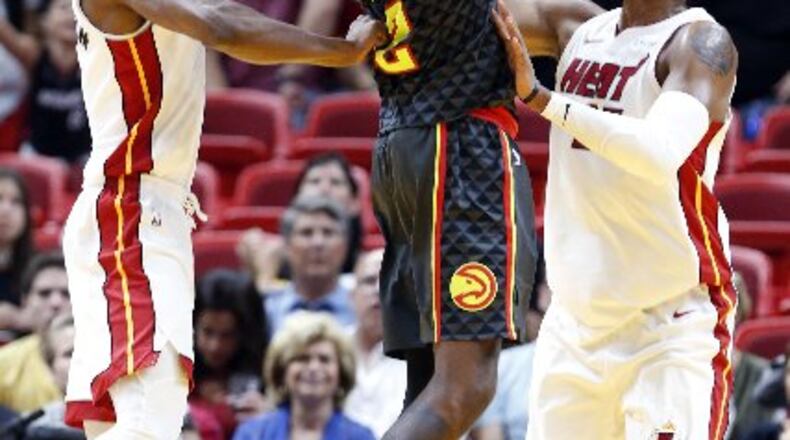 Taurean Prince and the short-handed Hawks couldn't finish in Miami. (AP Photo)