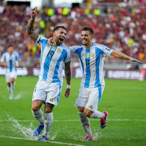 FILE - Argentina's Nicolas Otamendi (19, File) celebrates with Giovani Lo Celso after scoring his side's opening goal against Venezuela during a FIFA World Cup 2026 qualifying soccer match in Maturin, Venezuela, Thursday, Oct. 10, 2024. (AP Photo/Ariana Cubillos, File)
