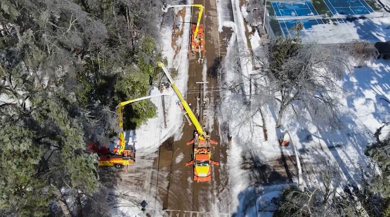 This image taken from a video released by the city of Oxford, Miss., shows crews working on power lines Tuesday, Jan. 27, 2026. (City of Oxford Mississippi via AP)