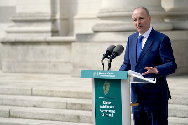 Taoiseach Micheal Martin speaks during a joint press conference with EU Commissioner for Democracy, Justice, the Rule of Law and Consumer Protection Michael McGrath, not pictured, following their meeting at Government Buildings, over the 20% tariff on imports from the EU announced by US President Donald Trump, which will significantly impact Ireland, in Dublin, Thursday April 3, 2025. (Brian Lawless/PA via AP)