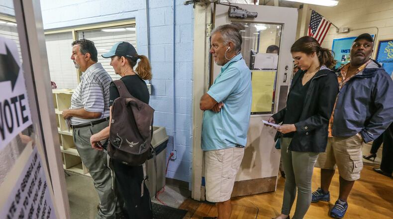 Voters line up in this June 2017 file photo at the Hammond Park Gymnasium at 705 Hammond Dr, Sandy Springs.