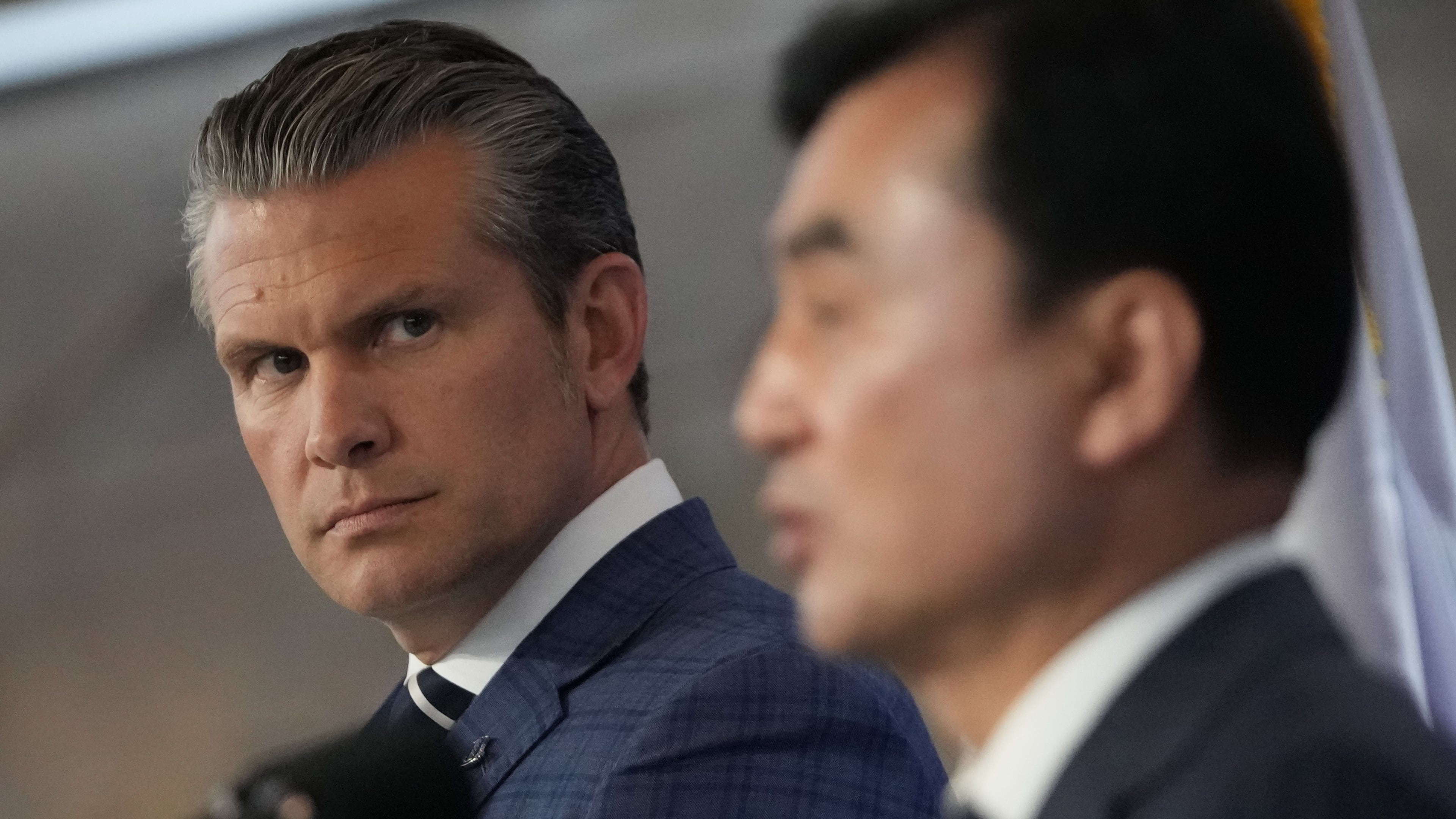 U.S. Defense Secretary Pete Hegseth, left, looks on as South Korean Defense Minister Ahn Gyu-back, right, speaks during the joint press conference following the 57th Security Consultative Meeting at the Defense Ministry in Seoul, South Korea, Tuesday, Nov. 4, 2025. (AP Photo/Lee Jin-man, Pool)