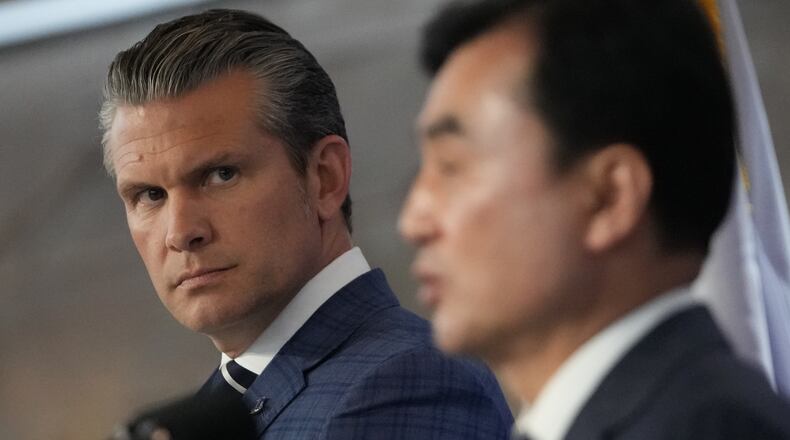 U.S. Defense Secretary Pete Hegseth, left, looks on as South Korean Defense Minister Ahn Gyu-back, right, speaks during the joint press conference following the 57th Security Consultative Meeting at the Defense Ministry in Seoul, South Korea, Tuesday, Nov. 4, 2025. (AP Photo/Lee Jin-man, Pool)