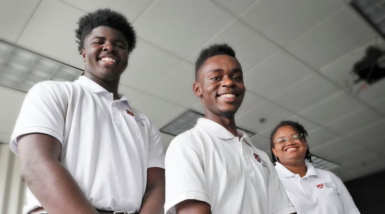 Debaters Jordan Thomas, (from left), Osazi Al Khaliq, and Payton Gunner returned home from Harvard University as champions. They were among 25 young scholars -- mostly black -- who participated in an annual residency hosted by the Harvard Debate Council. The summer institute concluded with a single elimination tournament, of which students of the Atlanta-based Harvard Debate Council Diversity (HDCDP) pipeline were victorious. BOB ANDRES /BANDRES@AJC.COM
