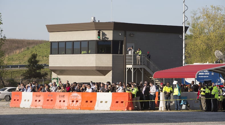 Observers where kept behind barriers as Hartsfield-Jackson International Airport held a full-scale disaster drill with Atlanta Firefighters, law enforcement, rescue personnel and nearly 150 volunteers who participated in a triennial exercise known as âBig Birdâ on Thursday, April 12, 2018. Airport personnel mobilized to a mock aircraft crash, extinguished the fire then triaged & treated the victims at a training site. The Federal Aviation Administration requires airports to conduct annual emergency preparedness drills and at least one full-scale drill every three years. (Photo by Phil Skinner)NOTE: getting Ids was impossible because the media was too far away.