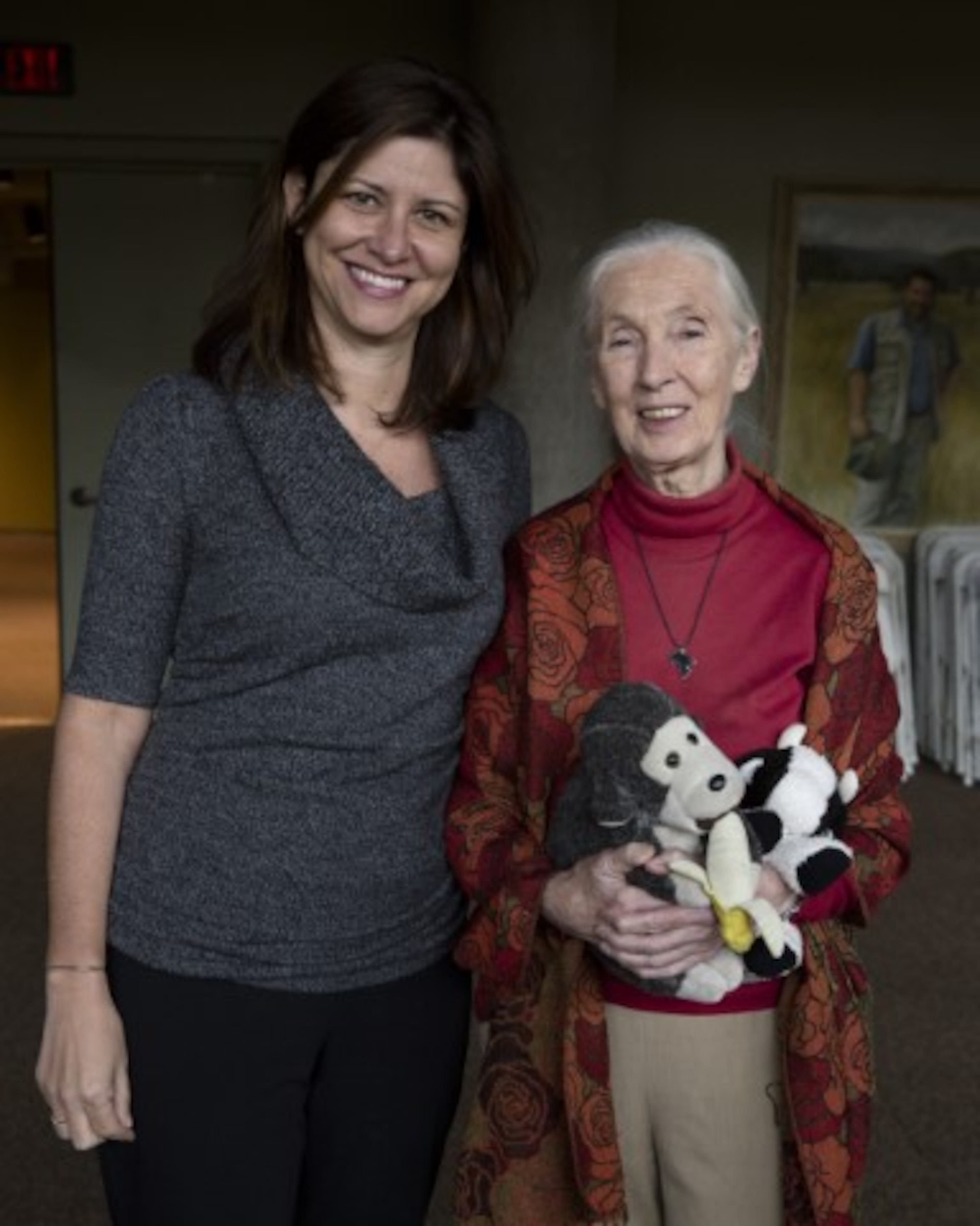 Tara Stoinski (left), CEO of the Dian Fossey Gorilla Fund, said she was inspired to become a primatologist after seeing Jane Goodall and other female primatologists pursue research in Africa. Stoinski visited with Goodall in 2014 when Goodall came to Zoo Atlanta to speak to middle schoolers. Goodall brought with her a stuffed monkey she was known for carrying at public events. (Courtesy of Zoo Atlanta)