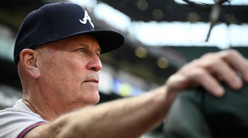 Atlanta Braves manager Brian Snitker watches from the dugout before the team's baseball game against the Baltimore Orioles, Wednesday, June 12, 2024, in Baltimore. (AP Photo/Nick Wass)