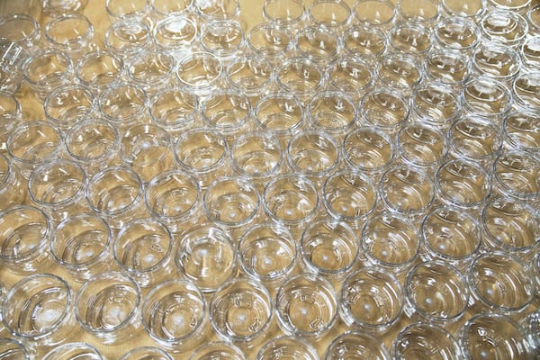 Plastic jars used for a Design Essentials moisture treatment hair mask are seen in a box at the McBride Research Laboratories manufacturing plant in Decatur, Ga., Monday, May 5, 2025. (AP Photo/Stephanie Scarbrough)