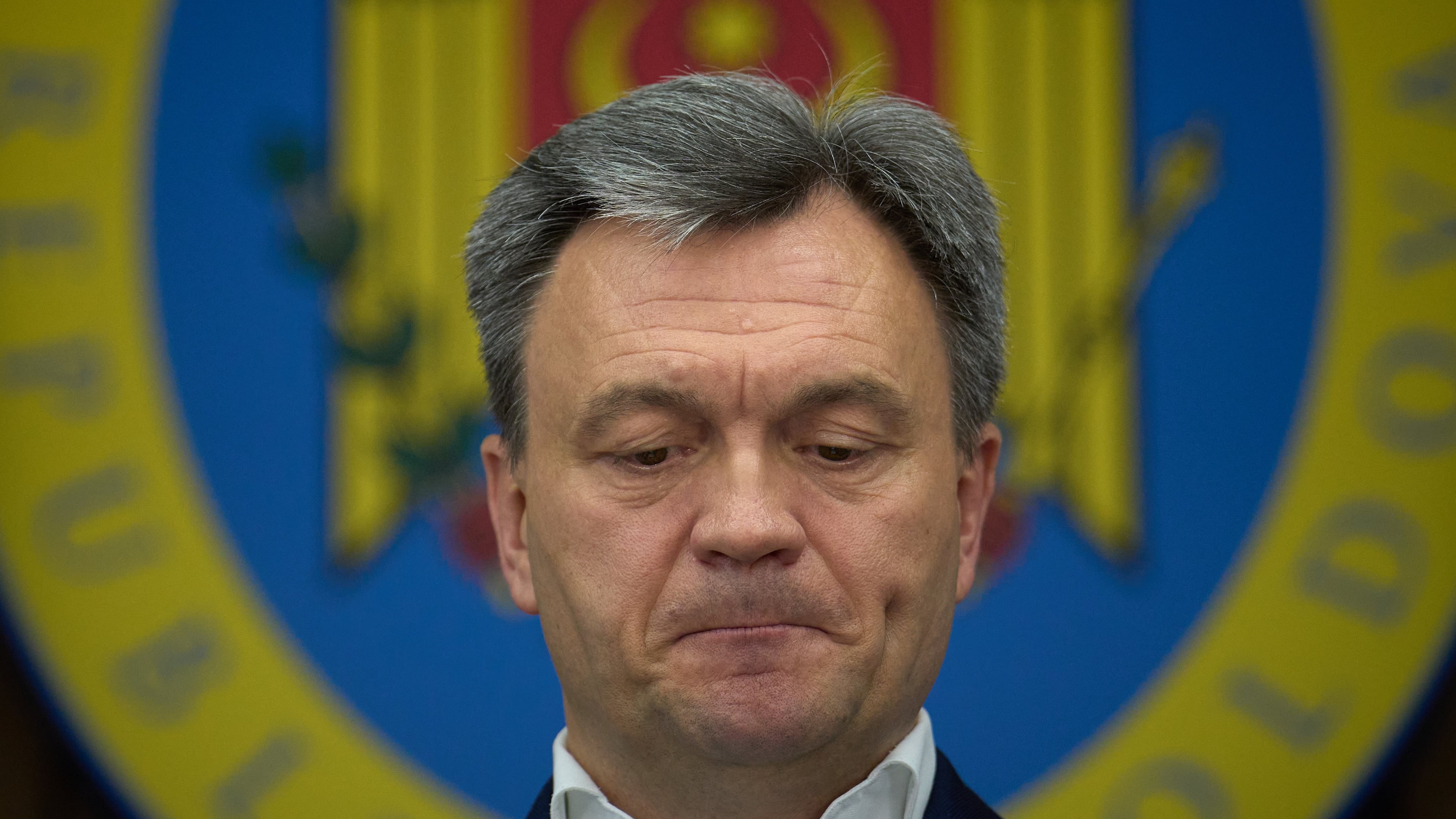 Moldova's Prime Minister Dorin Recean grimaces during statements on Russia's attempts to interfere in the country's upcoming Sept. 28 parliamentary elections in Chisinau, Moldova, Wednesday, Sept. 24, 2025. (AP Photo/Vadim Ghirda)