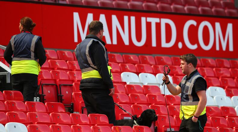 MANCHESTER, ENGLAND - MAY 15: A sniffer dog patrols the stands as the match is abandoned with fans evacuated from the ground prior to the Barclays Premier League match between Manchester United and AFC Bournemouth at Old Trafford on May 15, 2016 in Manchester, England. (Photo by Alex Livesey/Getty Images)