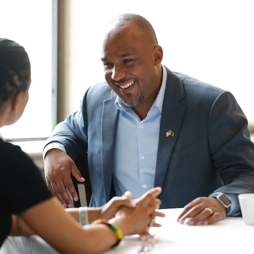 Mississippi Democratic U.S. Senate candidate Scott Colom speaks with Sen. Angela Alsobrooks, D-Md., before a campaign event at the Capital Club in Jackson, Miss., Saturday, Aug. 1, 2026. (AP Photo/Sarah Warnock)